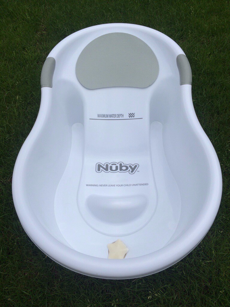 nuby baby bath with built in seat and soft headrest